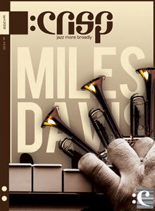 Magazine cover with trumpets, piano and a hand that resembles Mile Davis